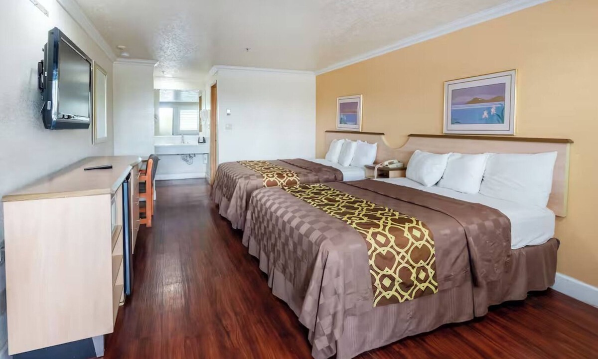 Corcoran Hotel | Essential Comforts in a Clean Room Near Transit & Local Dining Hotspots