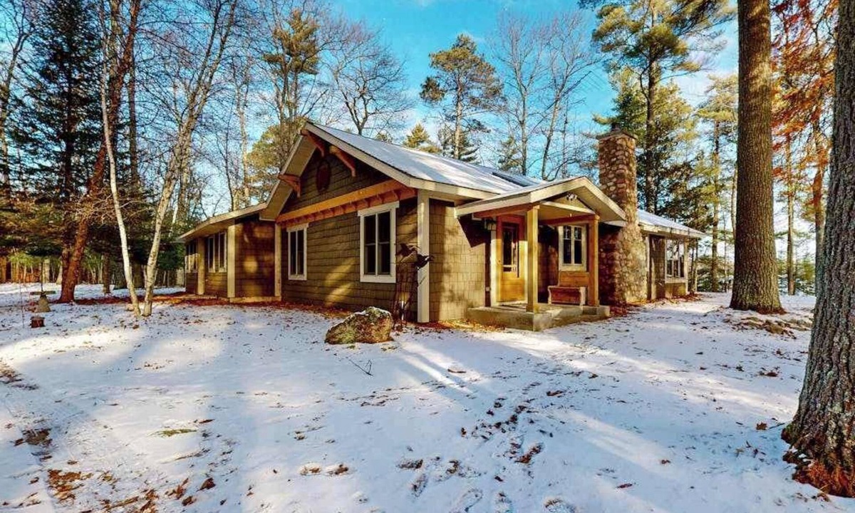St Germain House | Sprawling lakeside home with dock, kayaks, pool table, fireplace, grill, & AC