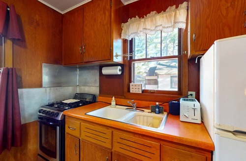 Manitowish Waters Cabin | Charming waterfront cottage with shared firepit, canoe, paddlebaot & docks