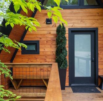 Johnson House | Designer A-Frame Treehouse with hot tub on river
