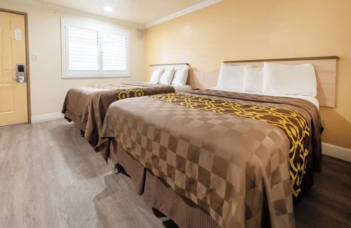 Corcoran Hotel | Essential Comforts in a Clean Room Near Transit & Local Dining Hotspots