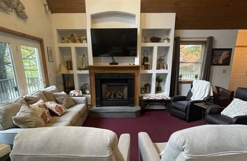 Shrewsbury Ski Chalet | Family Retreat! Large Game Room, fenced in yard with hot tub and fire pit.