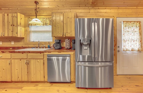 Boswell Cabin | Fire Pit, Screened Deck: Riverfront Ozarks Cabin!
