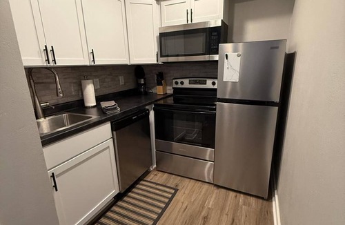 South Central Omaha Apartment | King Bed Oasis, Steps from UNO Bliss