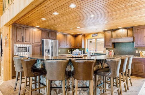 Conover House | Lakefront home with game rooms, dock, kayaks, private beach, fireplace, firepit