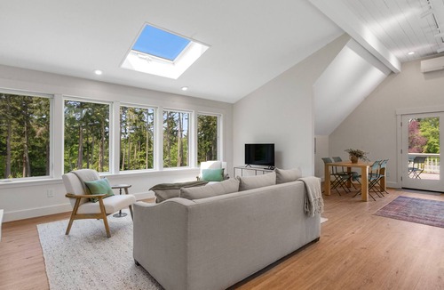 Freeland Cottage | New construction - upper-level home with expansive deck & orchard views