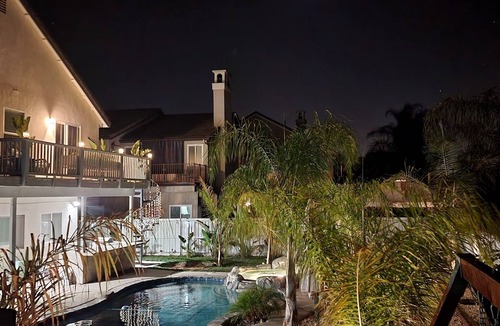 Temecula House | Private master Bedroom with tropical garden and pool view