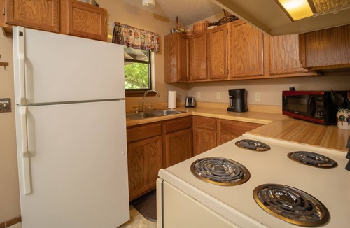 Boswell Cabin | Riverfront Cabin with Bluff Views Covered Deck and Hot Tub
