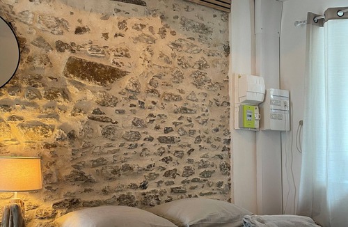 Coutances Apartment | Stone studio with character