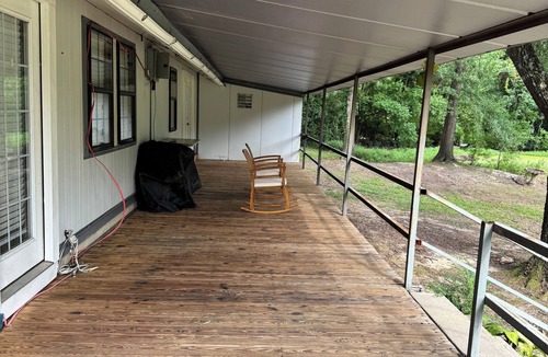 Fairbanks House | Unique camp style house with large wrap around deck.