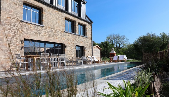 Architect-designed stone house with heated pool, just ten steps from the beach