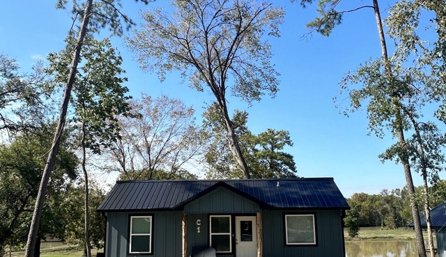 Newly constructed waterfront cabin C1 with pond and Trinity River views