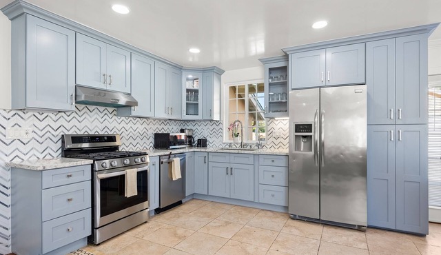 Spacious, single-level home with a large yard, gas fireplace, & washer/dryer